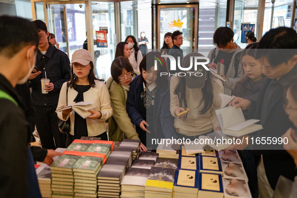 Citizens purchase books by novelist Han Kang, the 2024 Nobel Prize winner in Literature, at Kyobo Bookstore in Gwanghwamun, Jongno-gu, Seoul...