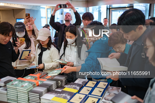 Citizens purchase books by novelist Han Kang, the 2024 Nobel Prize winner in Literature, at Kyobo Bookstore in Gwanghwamun, Jongno-gu, Seoul...