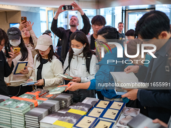 Citizens purchase books by novelist Han Kang, the 2024 Nobel Prize winner in Literature, at Kyobo Bookstore in Gwanghwamun, Jongno-gu, Seoul...