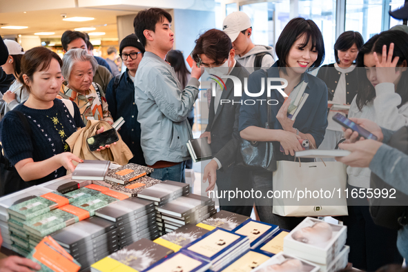 Citizens purchase books by novelist Han Kang, the 2024 Nobel Prize winner in Literature, at Kyobo Bookstore in Gwanghwamun, Jongno-gu, Seoul...