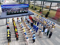 Participants gather during a fire emergency drill for a hazardous chemical tank farm leak in Lianyungang, Jiangsu province, China, on Octobe...