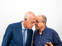 Presidential candidate Kais Saied talks with his brother Naoufel Saied at his campaign headquarters in Tunis, Tunisia, on September 17, 2019...