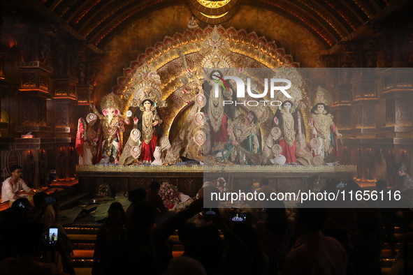 People visit a ''pandal'' or temporary platform during the Durga Puja festival in Kolkata, India, on October 11, 2024. The annual Durga Puja...