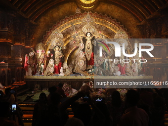 People visit a ''pandal'' or temporary platform during the Durga Puja festival in Kolkata, India, on October 11, 2024. The annual Durga Puja...