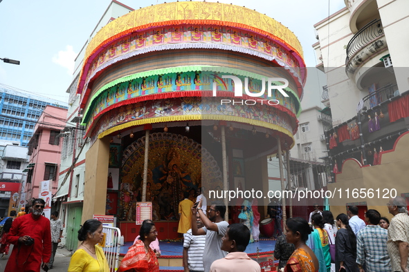 People visit a ''pandal'' or temporary platform during the Durga Puja festival in Kolkata, India, on October 11, 2024. The annual Durga Puja...