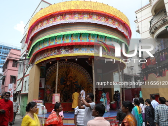 People visit a ''pandal'' or temporary platform during the Durga Puja festival in Kolkata, India, on October 11, 2024. The annual Durga Puja...