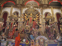 A Hindu priest prays in front of an idol of Durga, the Hindu goddess of power, during a ritual inside a ''pandal'' or temporary platform dur...