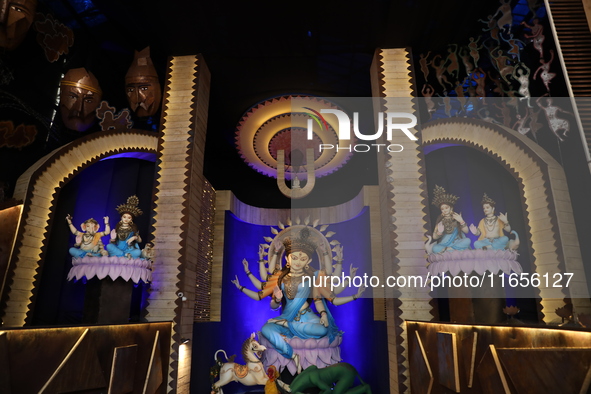 A Hindu goddess Durga is pictured inside a ''pandal'' or temporary platform during the Durga Puja festival in Kolkata, India, on October 11,...