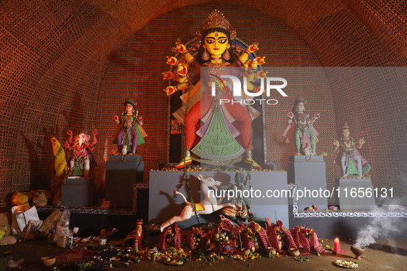 A Hindu goddess Durga is pictured inside a ''pandal'' or temporary platform during the Durga Puja festival in Kolkata, India, on October 11,...