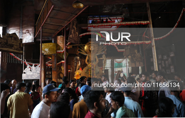 People visit a ''pandal'' or temporary platform during the Durga Puja festival in Kolkata, India, on October 11, 2024. The annual Durga Puja...