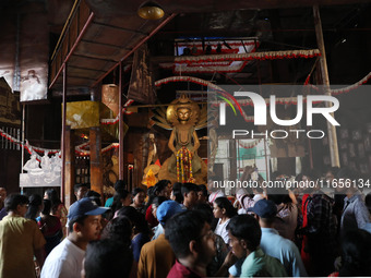 People visit a ''pandal'' or temporary platform during the Durga Puja festival in Kolkata, India, on October 11, 2024. The annual Durga Puja...