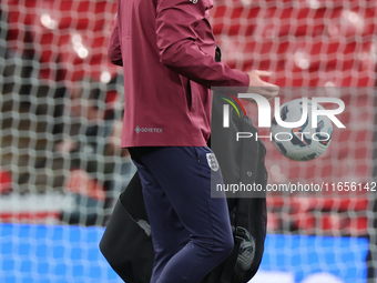 Lee Carsley, Interim Head Coach of England, participates in the pre-match warm-up during the UEFA Nations League Group 2 match between Engla...