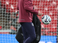 Lee Carsley, Interim Head Coach of England, participates in the pre-match warm-up during the UEFA Nations League Group 2 match between Engla...