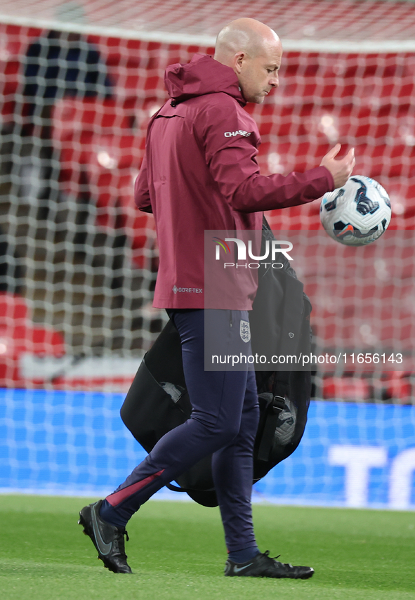 Lee Carsley, Interim Head Coach of England, participates in the pre-match warm-up during the UEFA Nations League Group 2 match between Engla...