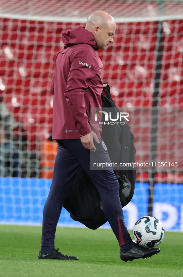 Lee Carsley, Interim Head Coach of England, participates in the pre-match warm-up during the UEFA Nations League Group 2 match between Engla...