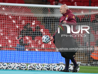 Lee Carsley, Interim Head Coach of England, participates in the pre-match warm-up during the UEFA Nations League Group 2 match between Engla...