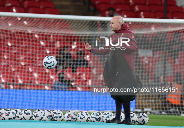 Lee Carsley, Interim Head Coach of England, participates in the pre-match warm-up during the UEFA Nations League Group 2 match between Engla...