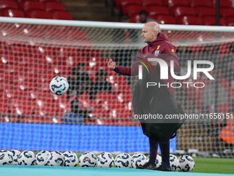 Lee Carsley, Interim Head Coach of England, participates in the pre-match warm-up during the UEFA Nations League Group 2 match between Engla...