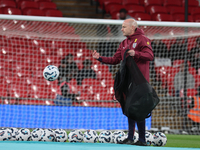 Lee Carsley, Interim Head Coach of England, participates in the pre-match warm-up during the UEFA Nations League Group 2 match between Engla...