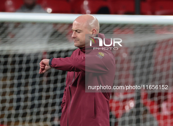 Lee Carsley, Interim Head Coach of England, participates in the pre-match warm-up during the UEFA Nations League Group 2 match between Engla...