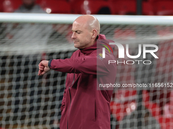 Lee Carsley, Interim Head Coach of England, participates in the pre-match warm-up during the UEFA Nations League Group 2 match between Engla...