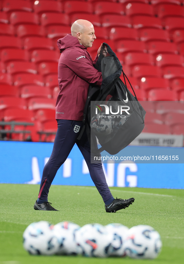 Lee Carsley, Interim Head Coach of England, participates in the pre-match warm-up during the UEFA Nations League Group 2 match between Engla...