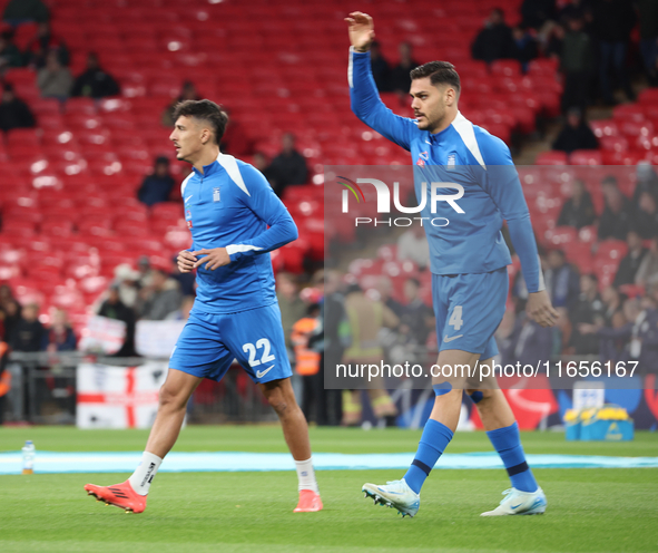 Dimitris Giannoulis of Greece and Ninos Mavropanos of Greece, from West Ham United, participate in the pre-match warm-up during the UEFA Nat...