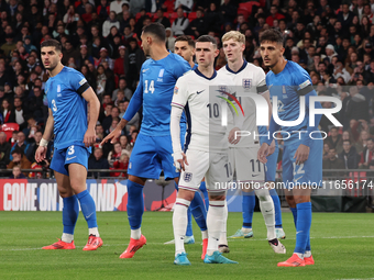 From left to right, Konstantinos Koullerakleof of Greece, Phil Foden of England, and Dimitris Giannouulis of Greece are in action during the...