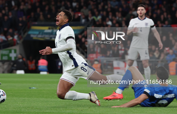 From left to right, Jude Bellingham of Real Madrid and England is tackled by Konstantinos Koullerakis of Greece during the UEFA Nations Leag...