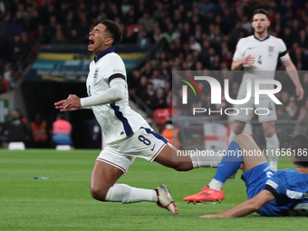 From left to right, Jude Bellingham of Real Madrid and England is tackled by Konstantinos Koullerakis of Greece during the UEFA Nations Leag...