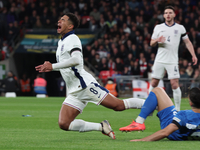 From left to right, Jude Bellingham of Real Madrid and England is tackled by Konstantinos Koullerakis of Greece during the UEFA Nations Leag...