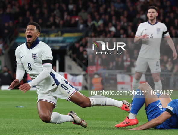 From left to right, Jude Bellingham of Real Madrid and England is tackled by Konstantinos Koullerakis of Greece during the UEFA Nations Leag...