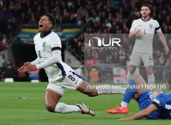 From left to right, Jude Bellingham of Real Madrid and England is tackled by Konstantinos Koullerakis of Greece during the UEFA Nations Leag...