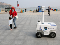 A public security intelligent security robot patrols a park in Lianyungang, China, on October 11, 2024. (