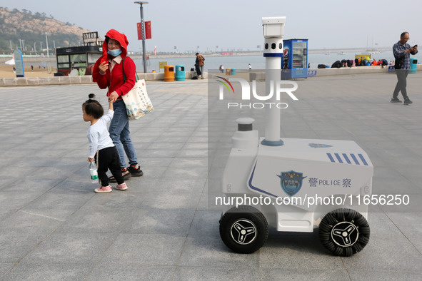 A public security intelligent security robot patrols a park in Lianyungang, China, on October 11, 2024. 