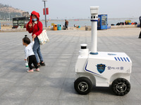 A public security intelligent security robot patrols a park in Lianyungang, China, on October 11, 2024. (