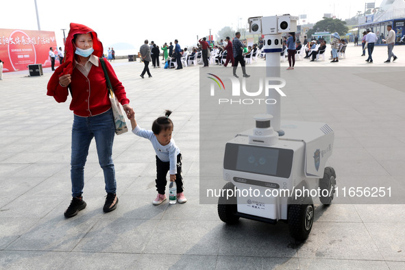 A public security intelligent security robot patrols a park in Lianyungang, China, on October 11, 2024. 