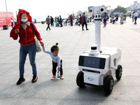 A public security intelligent security robot patrols a park in Lianyungang, China, on October 11, 2024. (