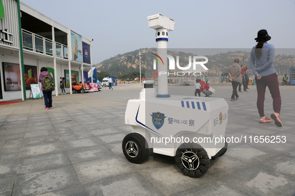 A public security intelligent security robot patrols a park in Lianyungang, China, on October 11, 2024. 