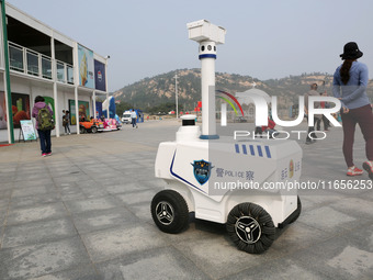 A public security intelligent security robot patrols a park in Lianyungang, China, on October 11, 2024. (