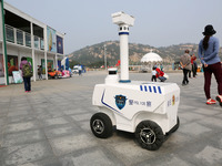 A public security intelligent security robot patrols a park in Lianyungang, China, on October 11, 2024. (