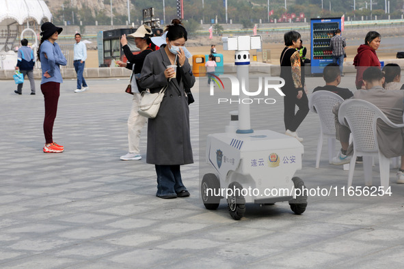 A public security intelligent security robot patrols a park in Lianyungang, China, on October 11, 2024. 