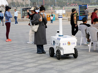 A public security intelligent security robot patrols a park in Lianyungang, China, on October 11, 2024. (