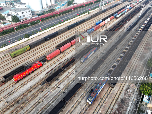 A cargo train prepares to depart at a railway marshalling station in Lianyungang, China, on October 11, 2024. 