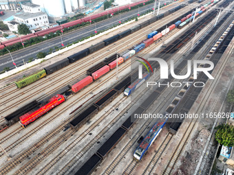 A cargo train prepares to depart at a railway marshalling station in Lianyungang, China, on October 11, 2024. (