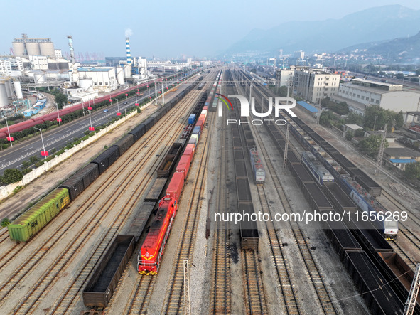 A cargo train prepares to depart at a railway marshalling station in Lianyungang, China, on October 11, 2024. 