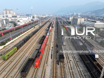 A cargo train prepares to depart at a railway marshalling station in Lianyungang, China, on October 11, 2024. (