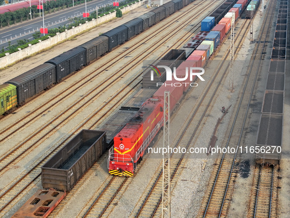 A cargo train prepares to depart at a railway marshalling station in Lianyungang, China, on October 11, 2024. 