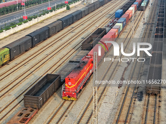 A cargo train prepares to depart at a railway marshalling station in Lianyungang, China, on October 11, 2024. (