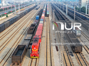 A cargo train prepares to depart at a railway marshalling station in Lianyungang, China, on October 11, 2024. (